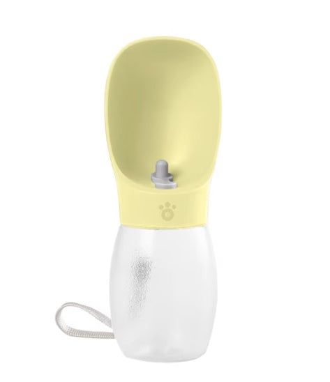 A pet collapsible water bottle and bowl set in pale yellow and translucent white, featuring a wrist strap and a small paw print logo on the yellow collar.