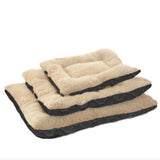 Three sizes of beige pet beds with black borders on a white background