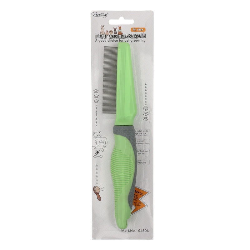 Pet grooming comb with green handle in packaging on a white background