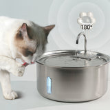 Cat drinking from a stainless steel pet water fountain with a paw icon and '180°' text.
