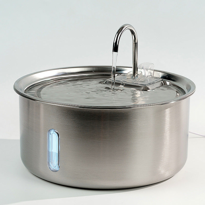 Stainless steel pot with a lid on a white background