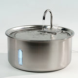Stainless steel pot with a lid on a white background