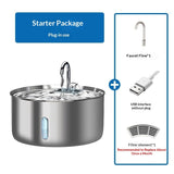 Stainless steel water fountain starter package with faucet, USB interface, and filter element on a white background.