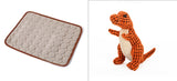 Textured mat and plush dinosaur toy on a white background