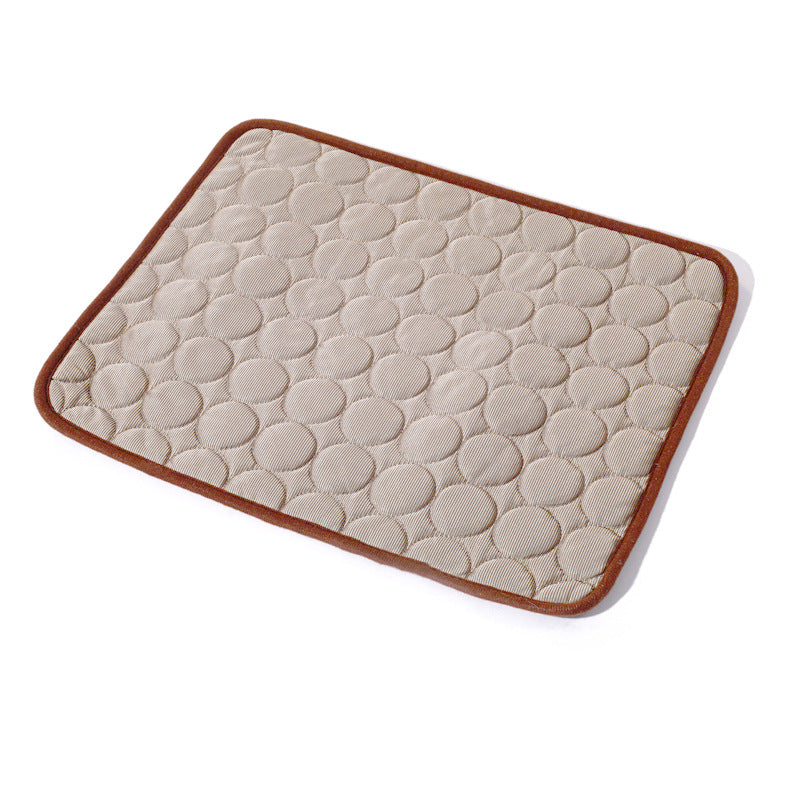 Beige quilted mat with brown border on a white background