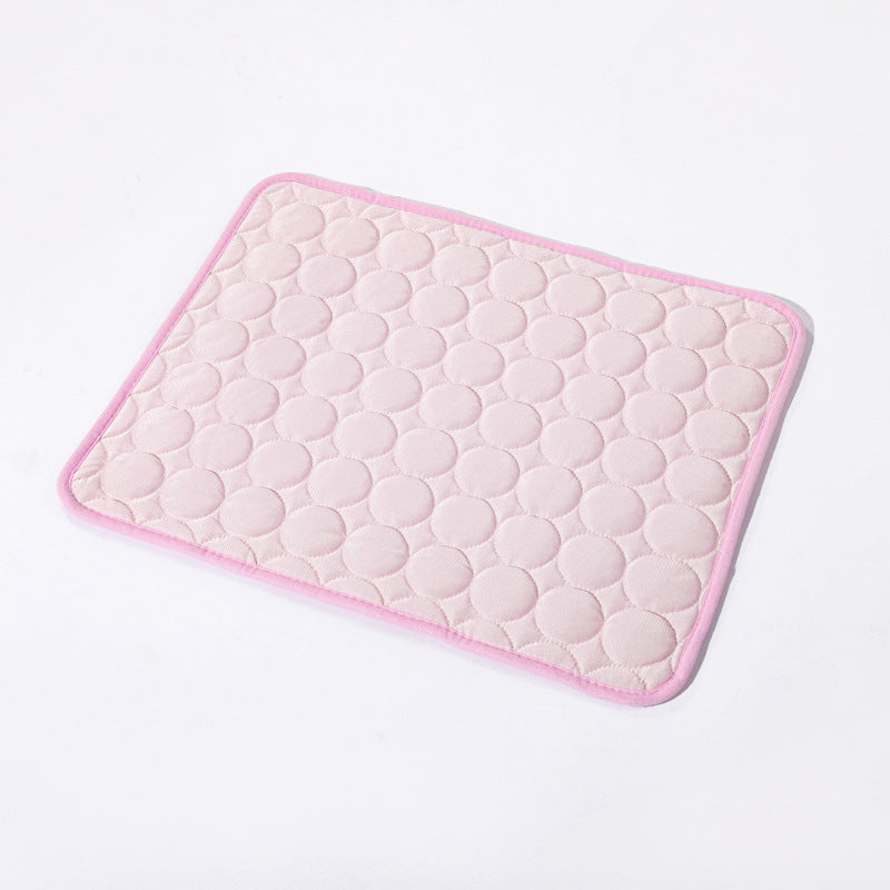Pink textured bath mat on a light gray background