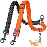 Orange and black dog leash with clip on a white background