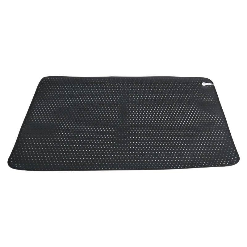 Black perforated mat on a white background