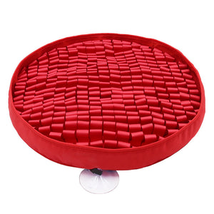 Round tray with blue, white, and gray cylindrical objects on a white background