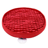 Red circular mat with textured surface on a white background
