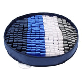 Round tray with blue, white, and gray cylindrical objects on a white background