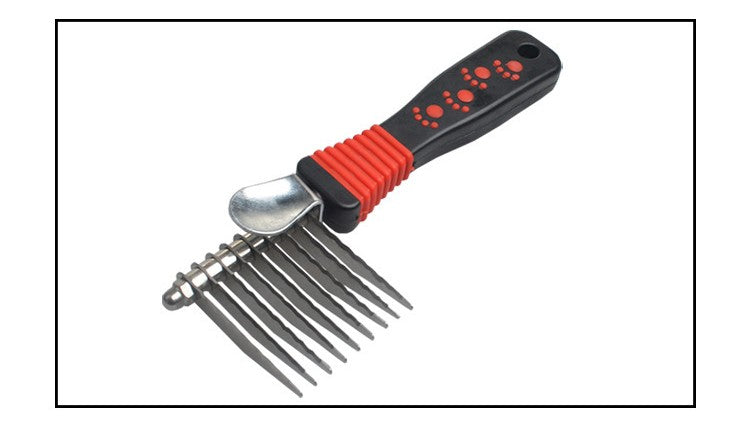 Pet grooming comb with red and black handle on a white background