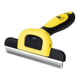Pet grooming brush with yellow and black handle on a white background
