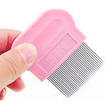 Pink pet grooming comb held by a hand on a white background