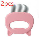 Pink pet grooming comb with metal teeth on a white background, labeled '2pcs'.