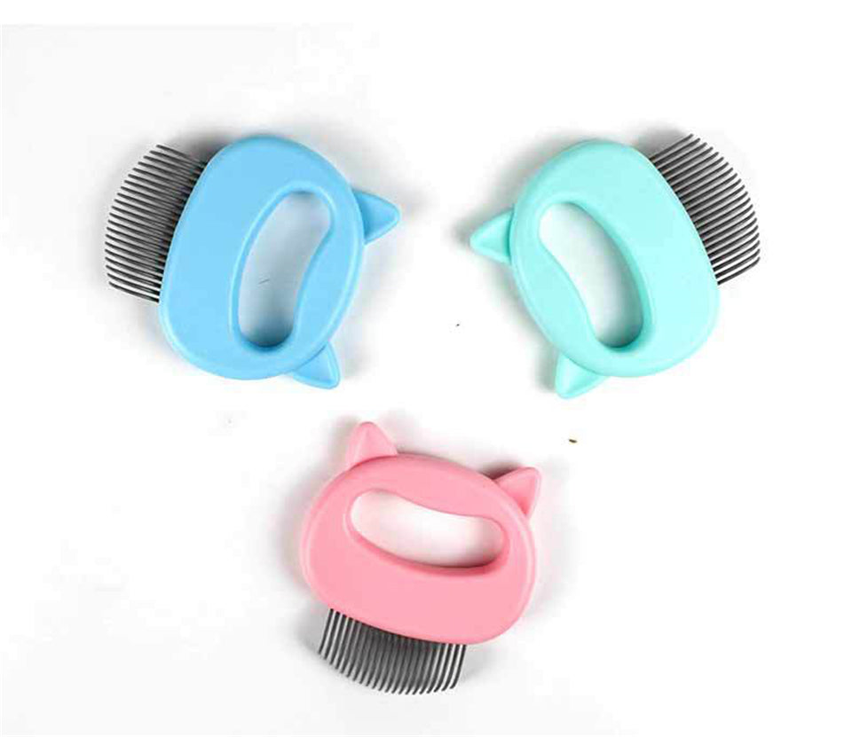 Three pet grooming tools with cat ear designs in blue, pink, and green on a white background.