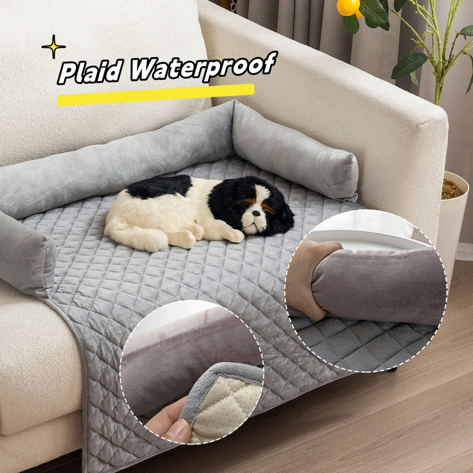 Dog lying on a gray plaid waterproof pet bed with close-up details in a living room.