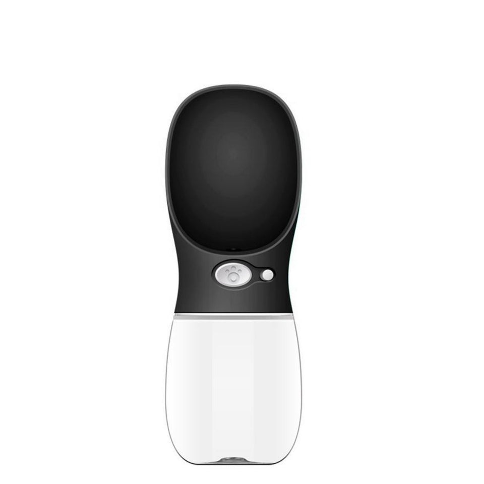 A modern pet water fountain with a black top section and a white bottom section, featuring a central button with a paw print icon and a small indicator light, set against a plain white background.