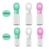 Set of three portable pet water bottles in green, white, and pink on a white background.