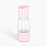 Clear and pink pet water bottle with measurements for water and kibble