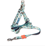 Dog leash with floral pattern and brand logo on a white background