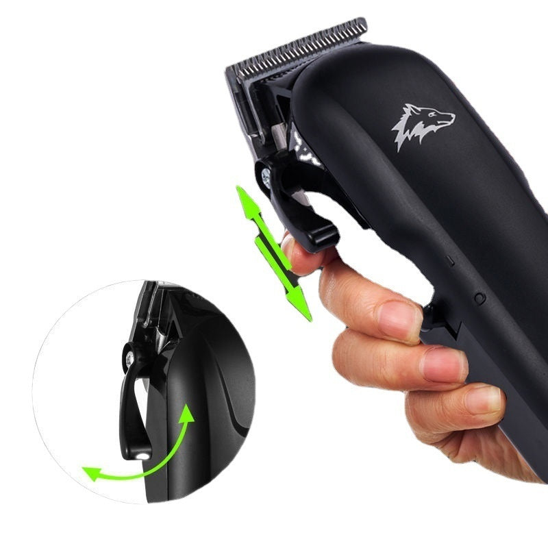 Black hair clipper held by a hand with close-up details on a white background