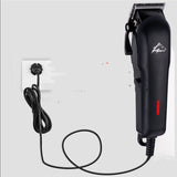 Black hair trimmer with cable on a white background
