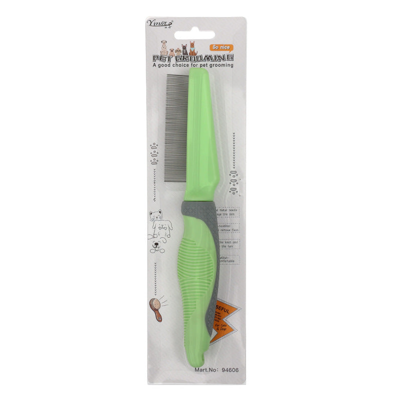 Green pet grooming comb in packaging on a white background