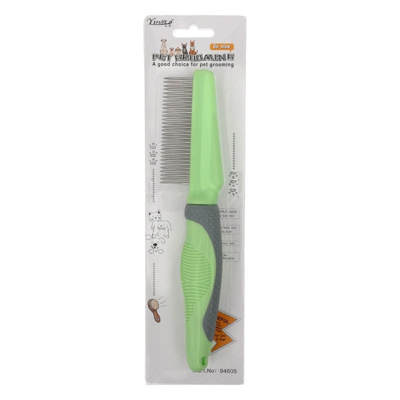 Green pet grooming comb with packaging on a white background