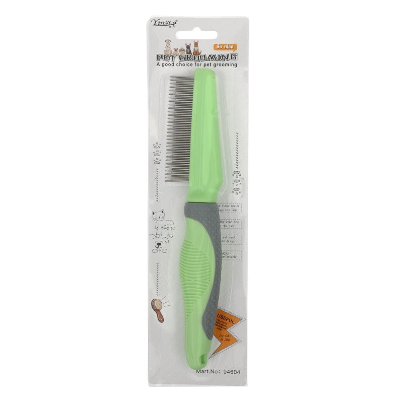 Green pet comb in packaging on a white background