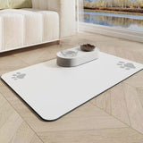 Pet mat with paw prints on a wooden floor in a living room setting.