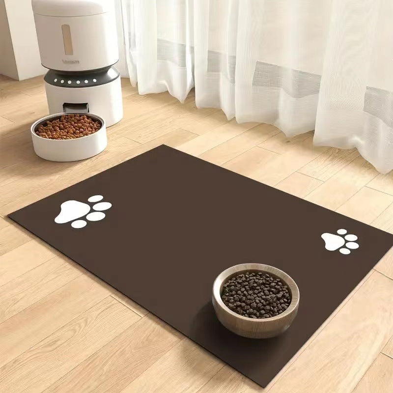 Pet mat with paw prints on a wooden floor with a pet bowl and food dispenser.