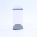 White cylindrical container with a gray base on a white background