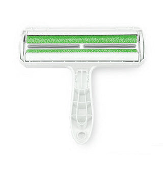 Cleaning tool with green scrubber on a white background