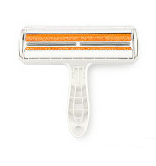 Cleaning roller with orange bristles on a white background