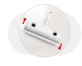 White cylindrical object with black circular holes on a white background