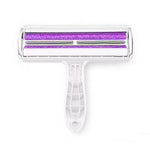 White pet hair removal roller with purple roller on a white background