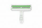 White pet grooming brush with green bristles on a white background