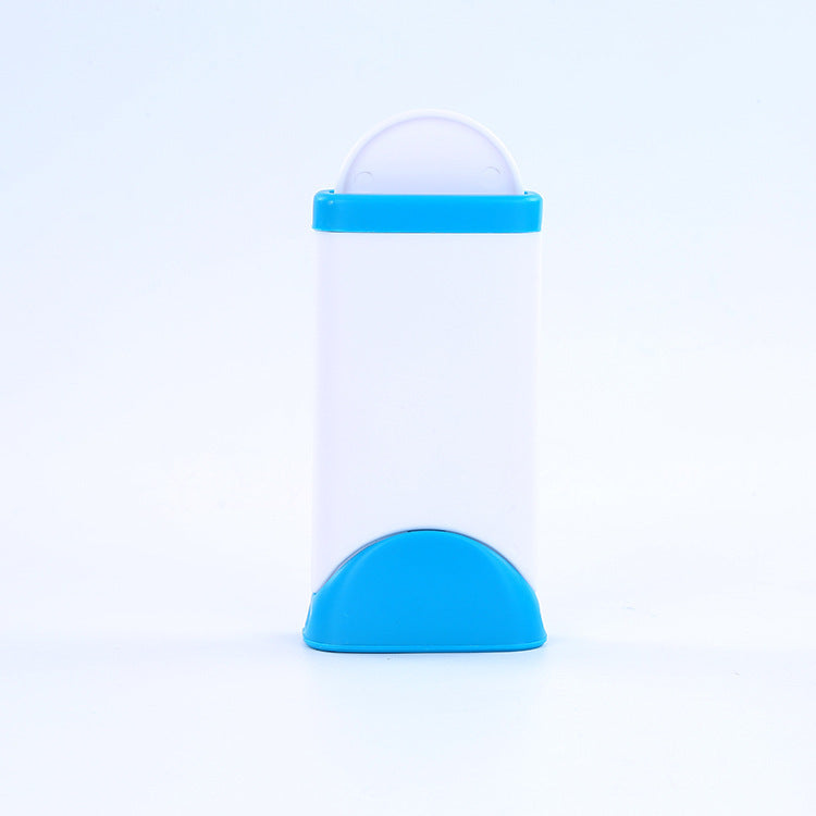 Transparent bottle with blue cap and base on a light blue background