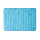 Blue textured bath mat on a white background