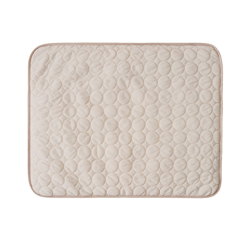 Quilted mat with circular pattern on a white background