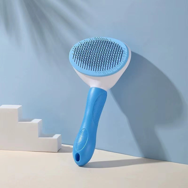 Blue pet grooming brush on a light blue background