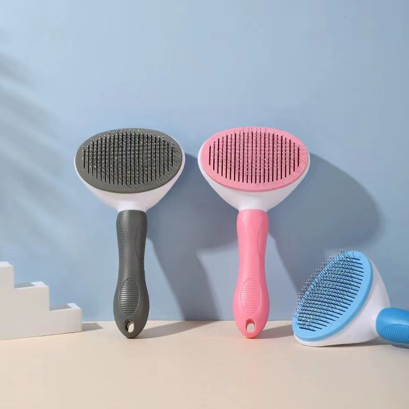 Three pet grooming brushes with different bristle designs on a light blue background.