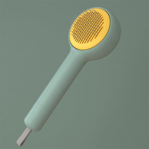 White handheld shower head with yellow nozzle on a mustard yellow background
