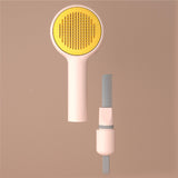 Hairbrush with yellow bristle head and white handle on a brown background