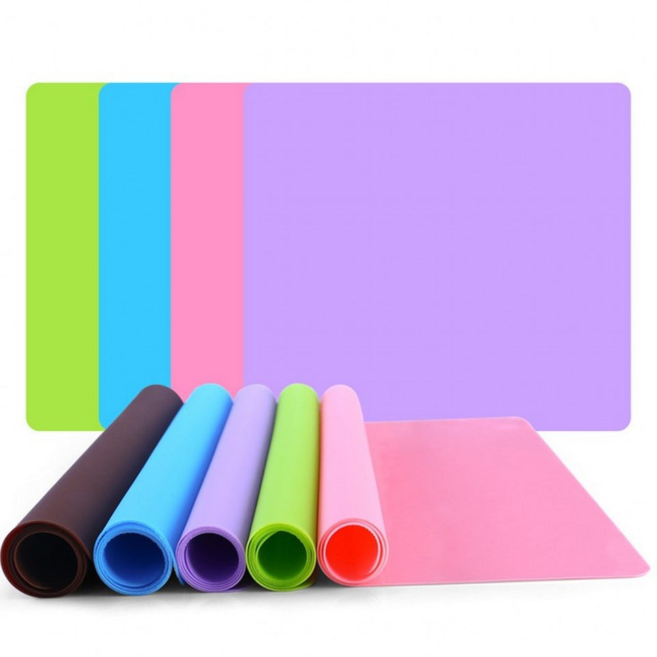 Set of colorful mats and rolls on a white background