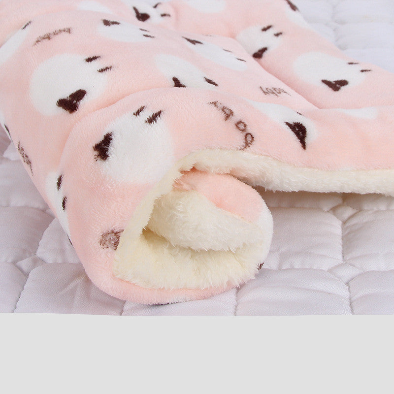 Roll of pink fabric with heart patterns on a white background