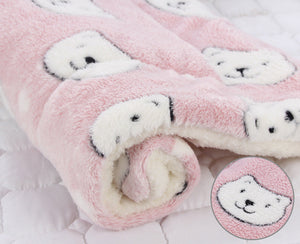 Roll of pink and white textured fabric on a white background