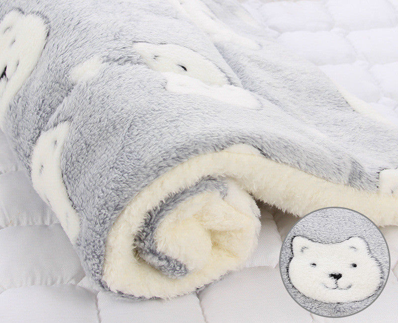 Fluffy gray and white blanket with a close-up of a bear face on a light gray background