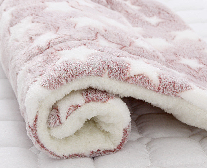 Roll of pink and white textured fabric on a white background